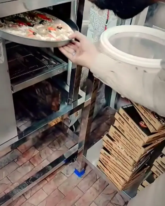 A loaded pizza on the peel